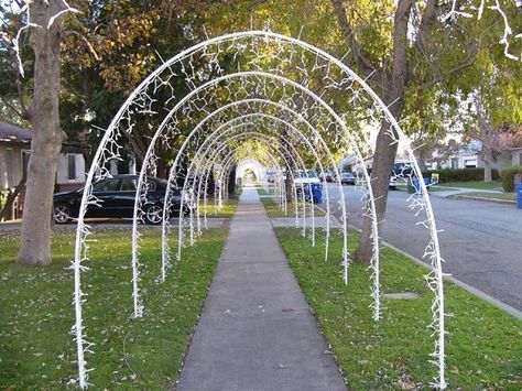 Lighted arches made out of 1/2 inch PVC pipe held in place by 3 foot rebar stakes. Each arch is 10 feet tall and 8 feet wide with 300 lights on each. Blush Christmas, Christmas Arch, Diy Christmas Lights, Christmas Light Installation, Christmas House Lights, Pvc Pipes, Christmas Yard Decorations, Christmas Lighting, Xmas Lights