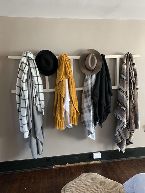 Ladder blanket hung on wall with hooks to hang blankets or scarves and hats Blanket Hanger On Wall, Ladder On Wall Decor, Hanging Blankets On Wall, Hanging Blanket Ladder, Ladder On Wall, Hang Blankets, Hanging Blankets, Wall With Hooks, Ladder Blanket