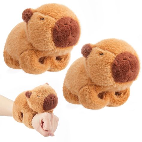 PRICES MAY VARY. Package Include: you will get 2 pieces plush capybara slap bracelets that can be easily worn and removed; With a simple tap, these adorable and fun slap bracelets are not only stylish but also come with a cute capybara plush toy Interactive Way: these stuffed animal huggers are a fun and interactive way for kids to wear their favorite animal on their wrist; Also can be applied as a tool for teaching about animals and their habitats, fostering educational play Soft Material: thes Capybara Themed Party, Christmas Birthday Party Favors, Capybara Plush, Educational Play, Cute Capybara, Wrist Accessories, Party Favors For Kids Birthday, Slap Bracelets, Christmas Birthday Party