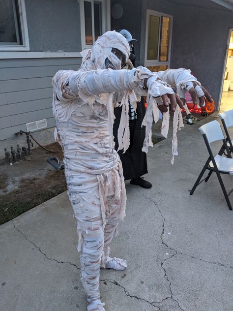 DIY Mummy costume. I used tea to age the white material and then brown and black chalk in spots. Mummy Costume Couple, Mummy Couple Costume, Mummies Costume, Mummy Fancy Dress, Mummy Costume Diy, Mummy Costumes, Diy Mummy Costume, Mummy Halloween Decorations, Diy Adult Halloween Costumes