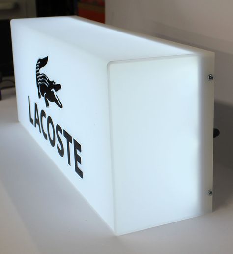 A great example of a Perspex® acrylic brand lightbox used by Lacoste. Lightbox Signage, Environmental Graphics Signage, Window Signage, Light Box Sign, Shop Door, Acrylic Display Box, Bar Shelves, Retail Signage, Neon Box