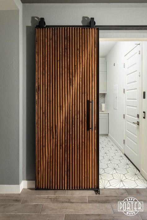 Walnut sliding door featuring custom parametric design for customer’s laundry room. Makes you want to get the chores done! Unique Sliding Door, Mid Century Sliding Door, Mid Century Modern Sliding Door, Unique Sliding Doors, Mid Century Modern Barn Door, Wood Sliding Door Design, Wooden Sliding Door Design, Slat Barn Door, Sliding Door Ideas