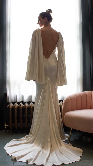 Halfpenny London | Wedding Dresses & Separates on Instagram: "The juxtaposition of structure and softness is so compelling to me and I adore the angelic, wing-like sleeves we created for the Hula dress. A dramatic low back and a magnificent, full godet flowing into a beautiful train were the finishing touches for this gown. Find your nearest place to try via the link in our bio. #HPLCourage #HalfpennyLondon" Handfasting Dress, Hula Dress, Dramatic Wedding Dress, Wedding Dress Separates, Halfpenny London, Dress Inspo, London Wedding, Low Back, Wedding Dresses