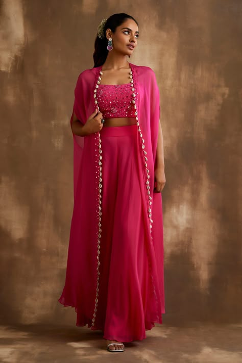 Shop for these amazing collections of Pink Georgette Embroidered Mirrorwork Cape: Embellished Blouse Set For Women by Niamh By Kriti online at Aza Fashions. Western Party Wear Outfits, Pink Indowestern Outfits, Pink Dress For Haldi, Pink Indo Western Dresses, Outfits For Sangeet Indian Weddings, Haldi Indowestern Outfit, Pink Haldi Outfit, Indian Sangeet Outfit, Indian Western Outfits