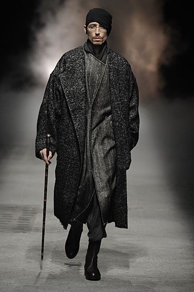 Alternating between black and ash gray, Damir Doma uses the fall season as the perfect opportunity to pack the volume back on. Creating his own bubble away from the world, Doma moves to cloak his man from the elements with meticulously constructed layers of seamless draping. Meanwhile, robe-like outerwear and billowing shapes act as a... [Read More] Urban Wizard, King Lear, Damir Doma, Indian People, Cyberpunk Fashion, August 19, Future Fashion, Fashion Black, Dark Fashion