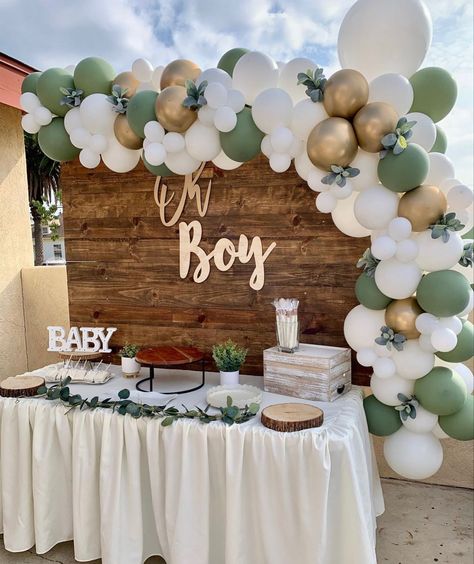 Find out how we decorated our oh baby baby shower! This sage green baby shower theme was perfect as gender neutral boho baby shower. It was a theme for baby boy's baby shower but it would totally work for both genders. I loved the green color themed baby shower that had a touch of 'oh baby' throughout. Get ideas on baby shower cake table decoration and how we have laid out the baby shower game table as well! Simple Baby Shower Decorations, Theme Bapteme, Décoration Baby Shower, Sage Green Baby Shower, Baby Shower Balloon Arch, Baby Shower Party Themes, Idee Babyshower, Baby Shower Theme Decorations, Baby Shower Deco