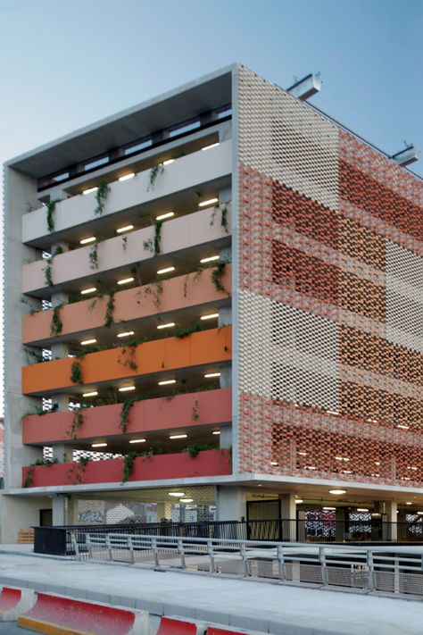 Flexbrick application at this astonishing carpark façade is favoring its urban integration while extending the public space between the project and the train station nearby. A prefabrication approach allows the building to easily be transformed for another purpose in the future, enabled by the easy installation and removal, and reusability of all the components inherent to the Flexbrick system. It is as easy as hanging or unhanging a curtain. #Flexbrick #Carpark #Architecture #Architects #Facade Parking Ideas Architecture, Urban Project, Public Building Architecture, Arch Facade, Vertical Building Architecture, Carpark Facade Design, Parking Building Architecture, Perforated Facade Architecture, Public Building Facade