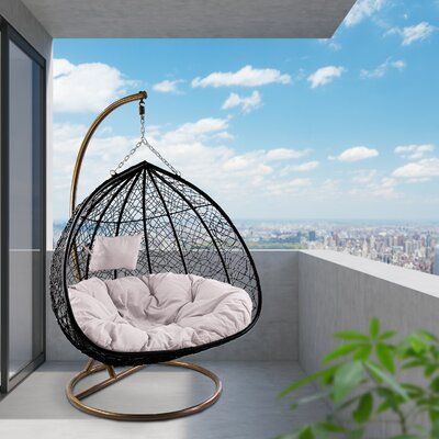 A great outdoor swing patio chair with a mat inside, great quality, teardrop shape. Sit in luxurious comfort while surrounded by the peace and beauty of your backyard with the cut-right double swing chair with stand hanging egg chair with cushion and stand. This steel chair is wrapped in beautiful resin wicker with a rich dark finish and features a gorgeous, intricate design. You'll relax comfortably on the tufted, double polyester cushion while you read, nap, or just enjoy a little time to your Swinging Chair Outdoor, Black Apartment Decor, Black Hanging Chair In Bedroom, Bedroom Desk Chair, Modern Hanging Chairs The Home Depot, Black Egg Chair Outdoor, Hanging Chair Black, Bubble Hanging Chair 💜, Indoor Swing Chair