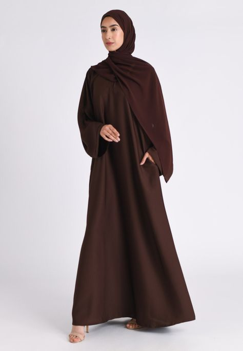 Our premium textured plain brown abaya is made from highest quality of polyester and crepe fabric. Extreme care is taken during the manufacturing process to ensure the fit and the stitching quality is at the optimum standard giving you the premium feel where compromise is not an option. The Brown Textured Abaya features Zip pockets in the seam of the abayas which remains hidden and is perfect for daily and casual wear. Ideal for Hajj, Umrah, Ramadan and daily wear. Also available in Nida and var Brown Abaya Outfit, Brown Abaya Hijab Outfit, Umrah Outfit For Women, Daily Abaya, Crepe Abaya, Brown Abaya, Plain Abaya, Ramadan Abaya, Stylish Abaya