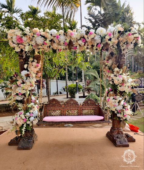 Your special day needs a special swing and we are dedicated to making it happen for you in the most magical way possible. Lots of kaleidoscopic floral ornaments, an explosion of colours with a hint of earthy tones blended together to create magic for you. #samanidecorators #weddingdecorator #weddingdetails #bridalswing #bridalseat #weddinginspo #floralornaments #floraldecor #weddingdecorations #bride #brideswing #weddingdecorationideas #weddingdecor #decorideas #floraldecor #weddingdecorideas # Garba Decor, Room Swing, Floral Ornaments, Stage Decoration, Engagement Decorations, Stage Decorations, Home Wedding, Earthy Tones, Floral Decor