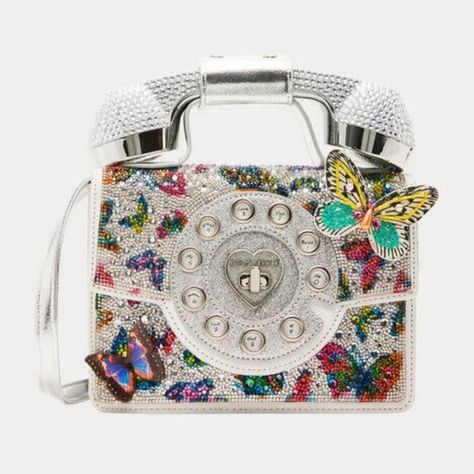 Betsey Johnson Kitsch Silver Butterfly Metallic Phone Crossbody Bag New Sealed Limited Edition Bj35170a *Item Ships Brand New In Original Packaging With Tags. We Are Licensed Sellers. We Sell To Collectors & Betsey Lovers* Betsey Has A New Update To Our Classic Phone Bag. This Version Is Complete With Rhinestone Embellishments And 3d Butterflies. The Phone Handle Detaches, So You Can Make And Receive Calls Wirelessly With Connectivity To Your Cell. Item Ships Brand New In Sealed Package With Tag Funky Purses, Classic Phones, Betsey Johnson Clothes, Retro Phone, Girly Bags, Unique Purses, Handbag Heaven, Wearable Tech, Betsey Johnson Bags