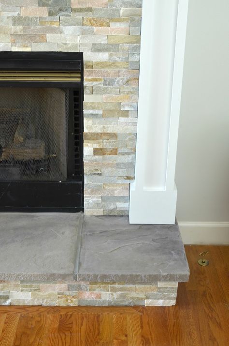 DIY Stone Tile Fireplace Makeover Tile Fireplace Makeover, Fireplace Hearth Stone, Stone Tile Fireplace, Diy Stone Fireplace, Fireplace Hearth Tiles, Tiles Fireplace, Hearth Tiles, Hearth Stone, Stacked Stone Fireplaces