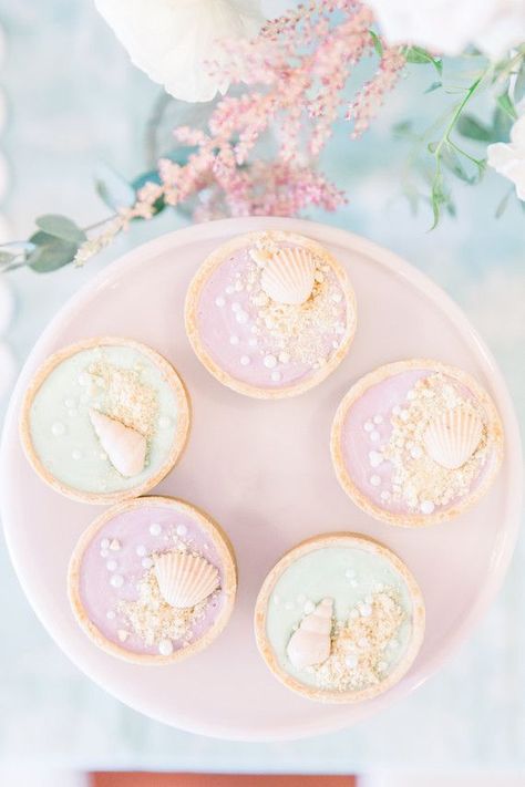 Pastel mermaid party from Pretty Little Events | 100 Layer Cakelet | Bloglovin’ Pastel Mermaid Party, Pastel Mermaid Birthday Party, Seashell Party, Nautical Cakes, Pink Cake Stand, Strand Party, Pastel Mermaid, Ariel Party, Mermaid Party Decorations