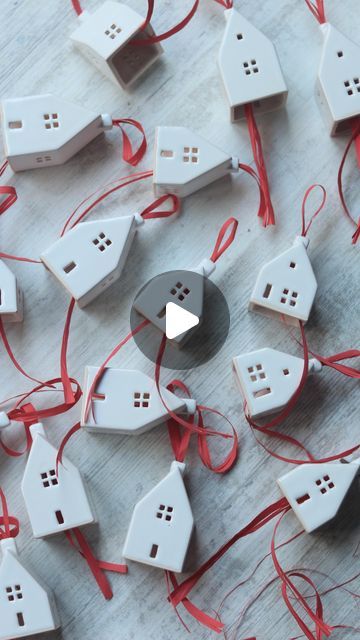 Maximilian on Instagram: "30 meters of ribbons + white houses + little boxes  Attaching red ribbons to ceramic Christmas houses that were preordered earlier in October.   If you ordered a set - thank you so much! You are awesome 🤩  Packing the last boxes today and shipping out on friday.  If you missed my October update for Christmas Ornaments, I’ve just opened Ornaments preorders with expected delivery in the first half of December 😉  • • • • • • #handmadegifts #homedecorations #handmadeceramics #independentartists #houseminiature #houseillustration" White Ceramic Houses Christmas, Ceramic Houses Christmas, White Ceramic Houses, House Christmas Ornaments, Christmas Houses, Pottery Houses, House Illustration, House Ornaments, Ceramic Houses