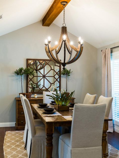 The dining room's rustic chandelier echoes the two used in the adjoining kitchen. The new home office is just behind this dining room wall and is in convenient proximity to the kitchen and living area. Rustic Dining Room Lighting, Neutral Dining Room, Modern Farmhouse Dining Room, Modern Farmhouse Dining, Dining Room Makeover, Rustic Dining Room, Farmhouse Dining Room, Dining Room Chandelier, Joanna Gaines