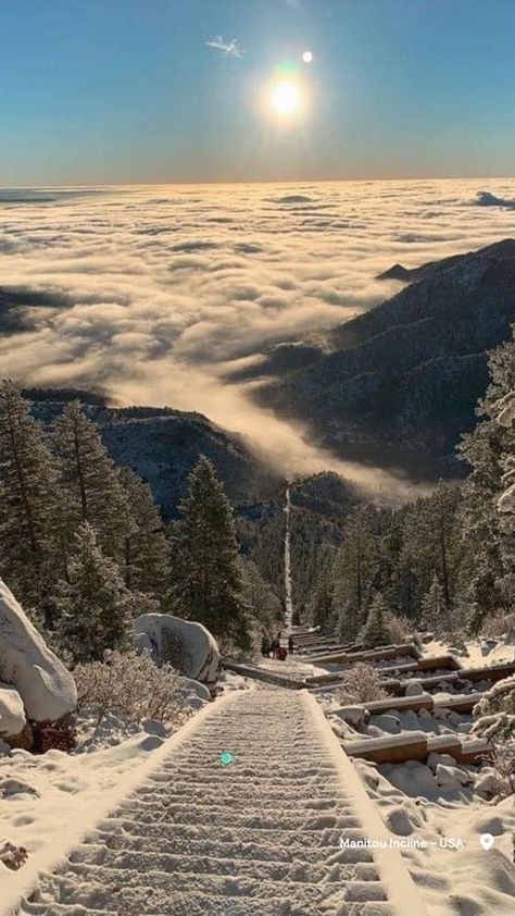 A sea of clouds sits beneath a steep climb of stairs covered in snow at the Manitou Incline. Estes Park Colorado Winter, Aspen Colorado Aesthetic, Vale Colorado, Colorado Springs Aesthetic, Colorado Springs Winter, Colorado Mountains Winter, Manitou Incline, Colorado Aesthetic, Manitou Springs Colorado