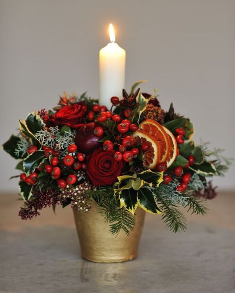 LOVE HOMEDIT? FOLLOW US 15k 1.1m 329k 9k 6.3k Sign up for our newsletter Christmas Centre Pieces, Xmas Flowers, Christmas Floral Designs, Christmas Flower Decorations, Christmas Centers, Candle Arrangements, Christmas Flower Arrangements, Christmas Table Centerpieces, Christmas Floral Arrangements