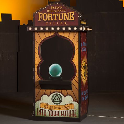 Add fun and entertainment and with our Bourbon Street Fortune Teller Booth. ?This three-sided, lighted prop makes an amazing addition to your celebration. Made of cardboard Measures 7' 5" high x 3' 7" wide x 2' 3" deep Window opening measures 2' 10" high x 2' 1" wide Shelf measures 2' 1" long x 5" deep Includes kit pieces, string lights, glue gun and glue sticks Assembly required Fortune Teller Booth, Fortune Teller Machine, Halloween Fortune Teller, Fortune Teller Costume, Haunted Carnival, Diy Party Ideas, Booth Diy, Creepy Carnival, Halloween Circus