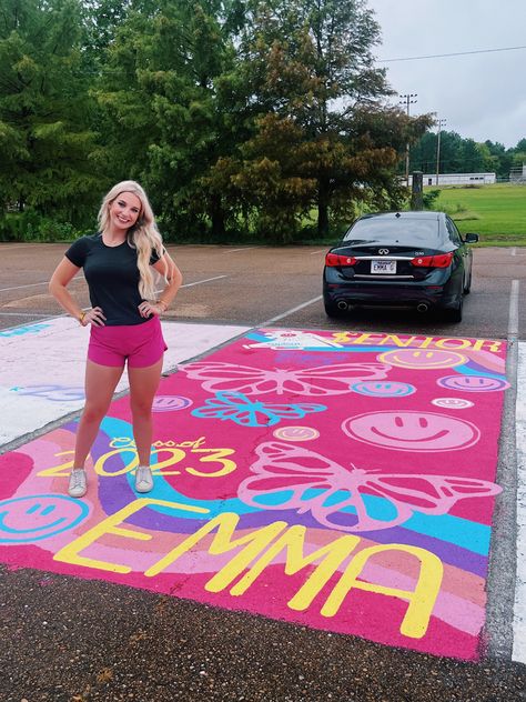 My senior parking spot!!! Smiley faces, butterflies, pink, preppy, all my fav things!!! 💖💖🦋😇 Hot Pink Senior Parking Spot, Rainbow Parking Spot, Graffiti Senior Parking Spot, Colorful Senior Parking Spots, Senior Parking Spots Butterfly, Hot Pink Parking Spot, Senior Parking Space Ideas Butterfly, Parking Lot Senior Painting, Parking Spot Painting Unique