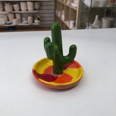 NEW STOCK ALERT! This is the first of our new Cactus Ring Holders that we've had painted and it looks great! Don't be prickly and book to come and say hello to us in the studio today! www.mycraftymonkey.com/bookings #potterypainting #pyop #craftstudiocambridgeshire #cactuspottery #ringholder Cactus Ring Holder, Cactus Pottery, Cactus Ring, Ring Holders, Pottery Crafts, Painting Studio, Craft Studio, Pottery Painting, In The Studio