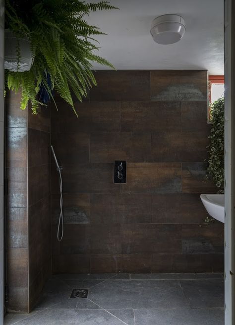 Corten Bathroom Design, Bronze Tile Bathroom, Bronze Bathroom Tiles, Dark Tiled Shower Ideas, Industrial Chic Bathroom Ideas, Industrial Chic Bathroom, Gothic London, Antique Bathroom Ideas, Moody Industrial