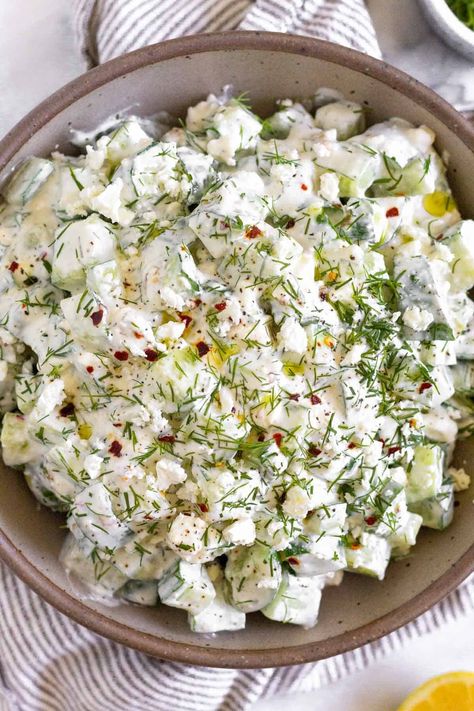 Fresh cucumber yogurt salad is a delicious and easy spin on tzatziki sauce. Made with cucumbers, greek yogurt, feta, fresh dill, & lemon juice Cucumber Yogurt Salad, Healthy Cucumber Salad, Cucumber Feta Salad, Yogurt Salad, Cucumber Dill Salad, Greek Yogurt Dressing, Chicken Caesar Pasta Salad, Cucumber Yogurt, Fresh Cucumber