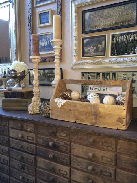 Old tool box, etc. Love the large frames around the smaller groupings! And the cabinet! Old Wooden Tool Box Decor Ideas, Old Tool Box Decor Ideas, Wooden Tool Box Decor, Wood Tool Box Ideas, Wooden Tool Box Ideas, Vintage Tool Box Decor, Toolbox Decor, Old Tool Boxes, Wood Tool Box