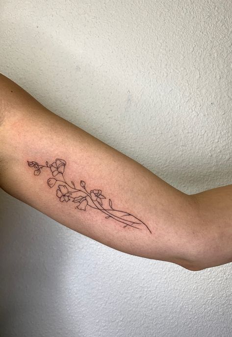 Inner bicep Sweetpea tattoo, Tattoo done by @miketa_tattoo on Instagram! Bicep Tattoo Placement Women, Tattoo Ideas Female Inner Bicep, Tattoo Ideas Inside Arm, Inside Of Bicep Tattoo Women, Tattoo Ideas Back Of Forearm, Flower Tattoo On Tricep, Wildflower Tattoo Inner Bicep, Floral Tattoo Inner Bicep, Inner Bicep Floral Tattoo Women