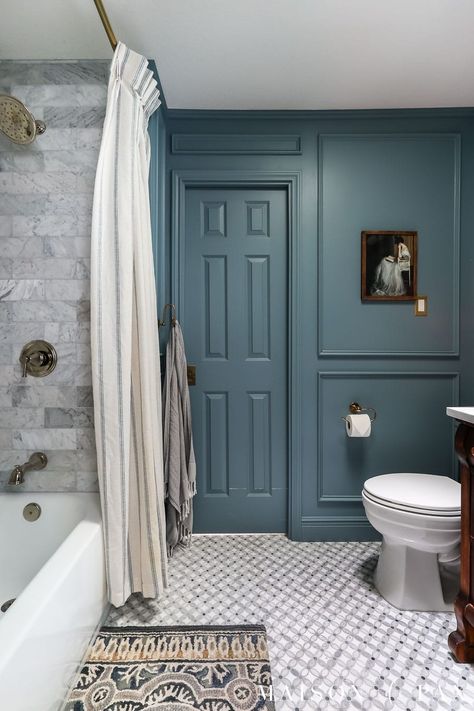 See how a 1980's standard space was transformed into a moody blue bathroom with elegant, timeless appeal. All Blue Powder Room, Antique Blue Bathroom, Dark Blue Bathroom Walls Paint, Blue Painted Vanity Bathroom, Blue Willow Bathroom, Blue Victorian Bathroom, Blue Bathroom Accent Wall, Blue Bathroom Vanity Paint Color, Smokey Blue Bathroom