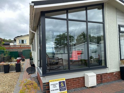 This customer decided to extended their living space by enclosing their porch area with anthracite grey UPVC windows and French doors. This unique design has created a versatile space that can be enjoyed all year round! The large expanses of glass provide unrestricted views and abundant natural light, making it a bright and inviting area at any time of day. Window Glazing, Porch Area, Upvc Windows, Aluminium Windows, Sash Windows, Time Of Day, French Doors, Home Renovation, Holiday Home