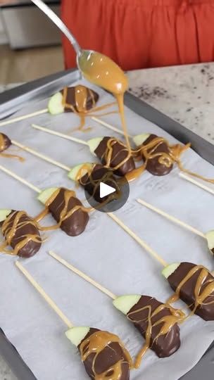 18K views · 138 reactions | DIY candy apple bites! 🍏 | DIY candy apple bites! 🍏 | By Liz Fenwick DIY | I love caramel apples but
they're really hard to eat. In this hack, I'm going to show
you how to make them the perfect bite-sized treat. Grab
a pan and line with parchment paper. Start with some
grannysmith apples and cut those. You're going to place
your skewer into your apple slice. We're going to melt some
almond bark in this glass. Then you're going to hold onto it
with your little skewer and stick it into the chocolate and
pull it straight up. Let any excess chocolate drip off of
your apple and then you're going to place it back on your
parchment paper. I'll set this in the fridge for 10 to 15
minutes. Next, I'll melt caramel and white chocolate in
the microwave. If you want to mak Carmel Apples Recipe How To Make, Chocolate Covered Caramel Apples, Caramel Apples Diy, Candied Apples Slices, Liz Fenwick Diy, Liz Fenwick, Dipped Apples, Apple Bites, Apple Slice