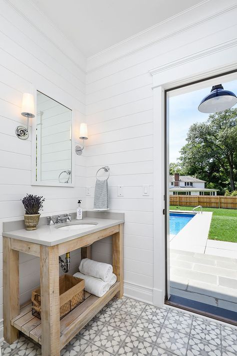 The room was designed with outdoor access leading to the pool and open-air shower. Small Pool Bathroom Ideas, Small Pool Bathroom, Pool House Bathroom Ideas, Pool House With Bathroom, Pool Bathroom Ideas, Outdoor Pool Bathroom, Cabana Bathroom, Small Pool House, Pool House Bathroom