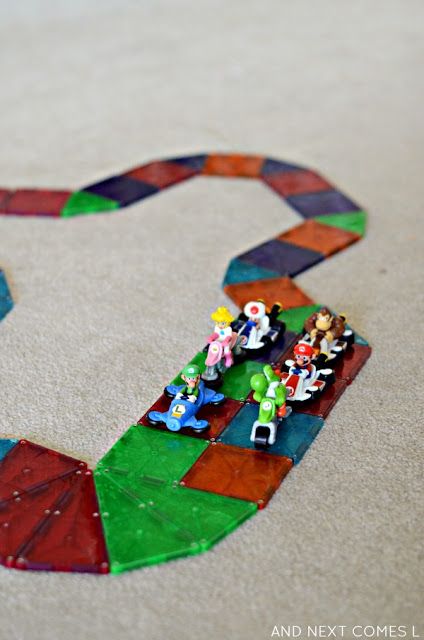 Building a rainbow road out of Magna-Tiles, inspired by the game Mario Kart from And Next Comes L Mario Kart Activities, Rainbow Road Mario Kart Decorations, Super Mario Race Track, Teach Boxes, Mario Kart Tracks Roads, Mario Kart Race Track, Mario Ideas, Mario Kart Rainbow Road, Rainbow Road Mario Kart