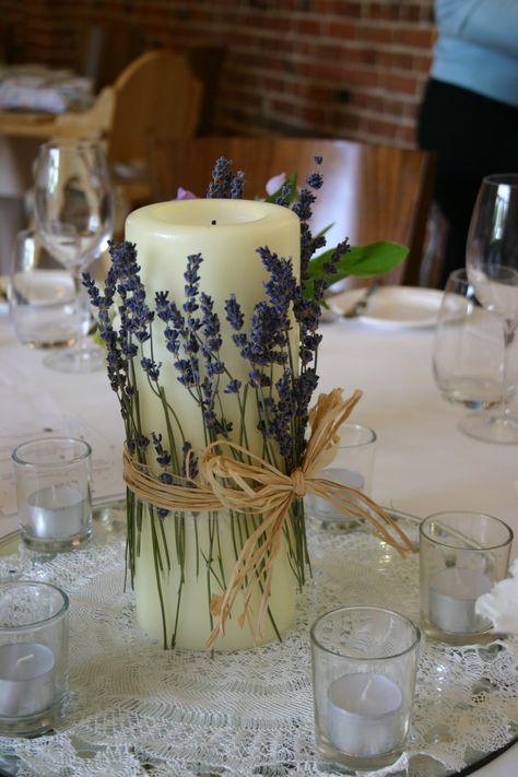 simple table centre idea wrapping dried lavender around a large church candle by Lindsey Kitchin of The White Horse Flower Company www.whfco.co.uk Lavender Wedding Decorations, Lavender Centerpieces, Lavender Wedding Theme, Wedding Candles Table, Church Candles, Lavender Wedding, Wedding Aisle, Lavender Flowers, Purple Wedding