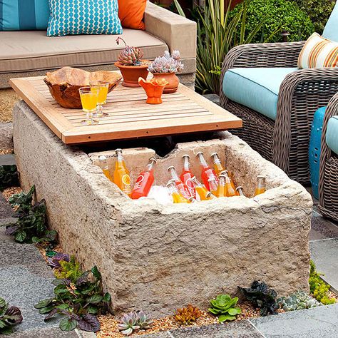 This custom table doubles as a built-in cooler! See more outdoor storage ideas: http://www.bhg.com/home-improvement/porch/outdoor-rooms/outdoor-storage-solutions/?socsrc=bhgpin040813coolertable=4 Outdoor Cooler, Outdoor Storage Solutions, Outdoor Fireplaces, Casa Exterior, Cool Tables, Samos, Dream Backyard, Small Patio, Outdoor Ideas