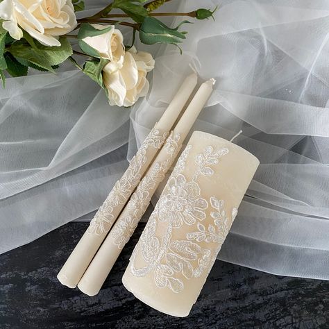 Shop beautiful creamy Lace Unity Candle Set with lace and personalize them with your names and wedding date. A stylish candle design will decorate the wedding ceremony. Wedding Unity Candle Set for your champagne (beige) wedding. Personalization on Tall candle is available. Select your set of candles in the drop-down menu. MEASUREMENTS: Medium pillar candle - 5,9 inch (15 cm) and diameter - 2,8 inch (7 cm) Tall pillar candle - 7,9 inch (20 cm) and diameter - 2,8 inch (7 cm) Height tapers - 9 inc Candle For Wedding Ceremony, Wedding Essentials Set, Candle Ceremony, Wedding Candles Ceremony, Unity Candles Wedding, Wedding Unity Candle Ideas, Wedding Candle, Unity Wedding Candles, Unity Candle Ideas