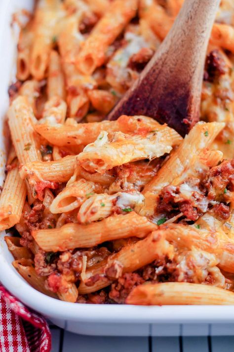 This comforting baked penne pasta is a cheesy classic casserole with ground beef, marinara sauce and of course cheese. This simple pasta casserole recipe is budget-friendly and a popular family dinner. Easy to make and great to reheat for leftovers too! Pasta Bakes With Ground Beef, Baked Penne With Ground Beef, Pasta With Hamburger, Penne Pasta Bake, Ground Beef Sauce, Sausage Penne, Casserole With Ground Beef, Baked Penne Pasta, Ground Beef Pasta Recipes