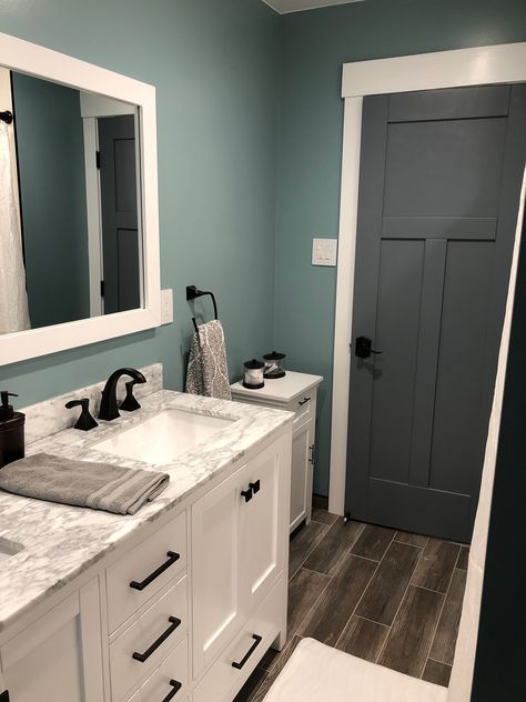 Our finished bathroom with paint color Sherwin Williams “Interesting Aqua” on the walls Bathroom Inspo Wall Color, Bathrooms Color Ideas, Best Blues For Bathrooms, Teal Gray Bathroom, Bathroom Remodel Paint Color Schemes, Bathroom Wall Colors Paint, Teal Bathroom Walls, Bathroom Remodel Colors Schemes, Interesting Aqua Sherwin Williams