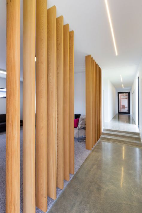 Wooden slat dividing wall Slat Dividing Wall, Wood Slat Wall Divider, Dividing Wall Ideas, Slat Wall Divider, Wall Divider Ideas, Dividing Wall, Office Cafeteria, Wall Divider, Cedar Walls