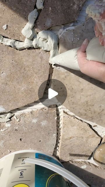 Sarahli Wilcox on Instagram: "Crazy Paving Tutorial ~  I can't believe how different this space looks! We went from a cracked, stained concrete slab under our gazebo to this natural stone masterpiece.  To get started on your patio deck dreams, when in doubt & on a budget, source  on offerup or FB marketplace, I found these 18” x 18” travertine stone tiles for $150 for over 300 pieces . In the end, I only used about 40-60 pieces, and I ended up selling the rest. If you want it to be, it can be really cost effective! In total I spent under $400 for this 144 sqft. space, probably less knowing now that I would sell the rest of the tiles.  To get the look, you’re going to have to break them into a variety of sizes depending how you want the final look. I’ve seen so many color & types of stones Concrete And Stone Patio, Diy Paving Ideas, Outdoor Tiles Over Concrete, Patio Tiles Over Concrete, Outdoor Tile Over Concrete, Diy Stone Patio, Dog Porch, Stone Shower Floor, Crazy Pave