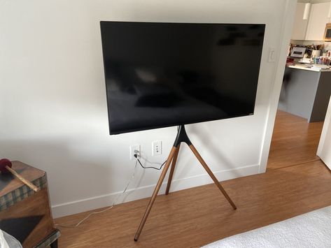 Tv Tripod Living Room, Tv In Easel, Tv Tripod Stand Living Room Ideas, Tripod Tv Stand Living Rooms, Samsung The Frame Tripod, Easel Tv Stand Bedroom, Tv Tripod Stand, Tv Tripod, Tripod Tv Stand