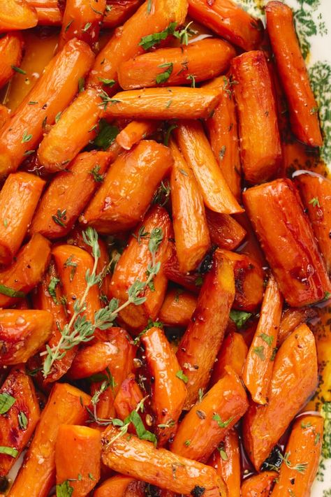 My maple-glazed carrots are a quick and easy side dish that my whole family loves! Perfect for weeknight dinners or a beautiful addition to your holiday table. With a mix of vegan butter, pure maple syrup (or honey), garlic, and fresh herbs, this easy recipe is a hit even with picky eaters! Spiced Carrots Recipe, Vegan Carrot Recipes Side Dishes, Maple Butter Carrots, Maple Carrots Stovetop, Maple Glaze Carrots, Vegan Glazed Carrots, Crockpot Maple Carrots, Maple Honey Carrots, Maple Glazed Roasted Carrots