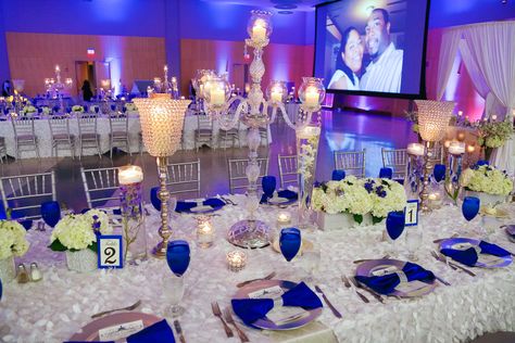 Our Royal Blue and White Wedding Bridal Party -  Blue Wedding Reception Decor - Candelabras - Blue Goblets - Silver Chargers - Ivory Linen - Hydrangeas Roses Centerpieces - Family Styled Reception Seating - Black African American Elegant Wedding Royal Blue And Silver Wedding, Royal Blue Wedding Decorations, Royal Blue Wedding Theme, Classic Blue Wedding, Blue And Silver Wedding, Blue Wedding Receptions, Silver Wedding Decorations, Blue Wedding Centerpieces, Blue Wedding Decorations