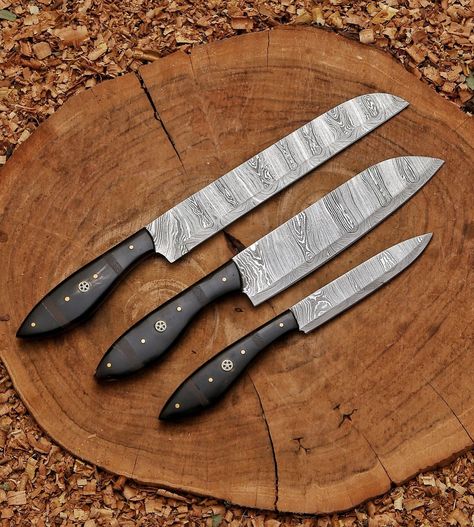 Kitchen knife set | Custom Forged chef Knives Set| cutlery set | Chef gift | Anniversary gift | Arham Cutlery This kitchen knife set is Perfect for Anniversary gift, Easter Gift, Chef gift, camping, kitchen knife, Chef knife boy scouts, the outdoors, kayaking, boating, backpacking, canoeing, or anything for the outdoors! Knife Details: Knife Materials: Blade Material: Hand forged amascus steel Handle Material: Bull horn with wengi wood spacers Handmade Leather carry bag is Included Knife... Camping Kitchen, Kitchen Knife Set, Bull Horns, Chef Knives, Chef Knife Set, Chef Gifts, Knife Set Kitchen, Cool Knives, Handmade Knives