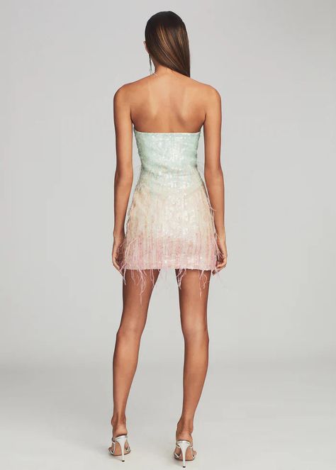 Let loose in our Anastasia Dress — a playful mini that will make any moment memorable. The shimmering dress features pastel sequins and airy feather embellishments throughout, creating a beautiful ombré effect. The strapless silhouette is designed with supportive boning through the bodice to contour the curves of the body and is finished with an invisible zip closure. Shown here in Feather. HANDMADE Self: 95% Polyester, 5% Lycra, Trim: 100% Ostrich Feather Made in India Sequin Feather Dress, Alphabet Earrings, Shimmering Dress, Halloween Crop Top, Anastasia Dress, Halloween Skirt, Ombre Effect, Feather Dress, Invisible Zip