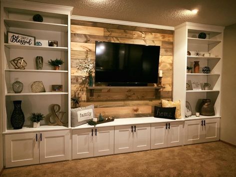 Basement Family Room Built Ins, Wallpaper On Entertainment Center, Built In Media Cabinet Ideas, Built In Entertainment Center Decor, Media Room Design Ideas, Bookcase With Tv In Middle, Tv Wall Design With Storage, Built In Wall Shelves Living Room, Built In Bookshelves Around Tv