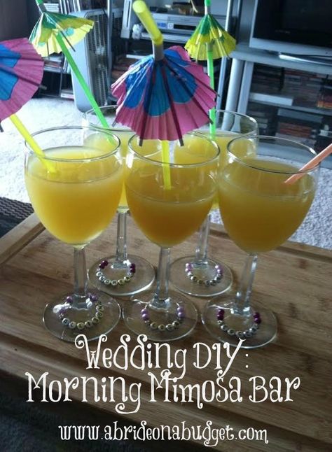 Start celebrating wedding morning with this DIY Wedding Morning Mimosa Bar. Get details at www.abrideonabudget.com. Budget Wedding Diy, Diy Wedding Bar, Cute Wine Glasses, Twine Diy, Wedding Morning, Glitter Wine, Mimosa Bar, Personalized Bride, Wedding Diy