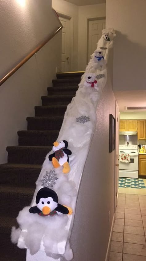 DIY Christmas decoration. Stairway decoration. Penguin slide. JRK Penguins Sliding Down Banister, Christmas Penguin Stair Slide, Penguins On Staircase, Christmas Bannister, Christmas Penguin Door, Penguin Hallway Decorations, Christmas Staircase Decor, Christmas Staircase, Penguin Christmas