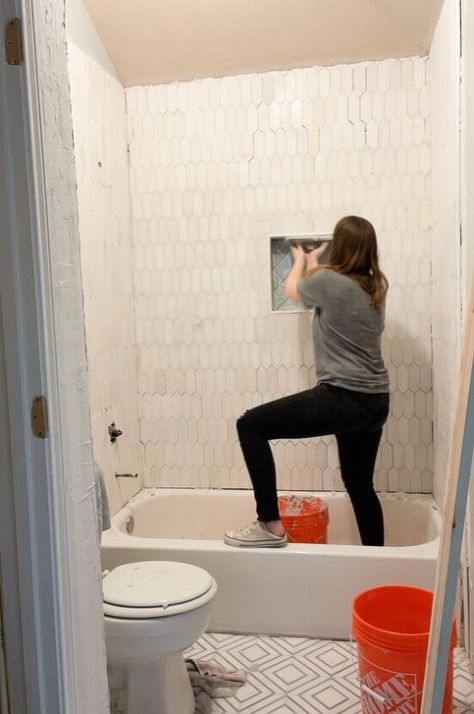 Have you ever wanted to remodel a shower but feel intimidated by what it entails? Its not as hard as you think! Heres the step by step to get you from the gut to the tile on 2 different style showers! First up, a shower with a tub surround! Heres what it looked like before. We pulled out all the old tile and drywall. Ripping it down to the studs gives us a fresh start. Typically builders tile right over drywall which almost always results in mold. So we prefer to get it all out and… Diy Bathtub Tile Tub Surround, Tub Shower Combo Remodel Diy, Upgrade Tub Shower Combo, Diy Tile Bathtub, Remove Shower Tile, Diy Tub Shower Remodel, Replacing Shower Insert With Tile, Budget Tile Shower Ideas, Diy Tile Tub Surround