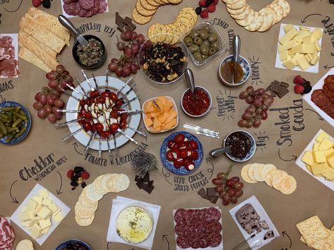 Large Charcuterie Board displayed on brown butcher paper Chalk Charcuterie Board, Grazing Table Brown Paper, Grazing Table On Brown Paper, Charcuterie Brown Paper, Charcuterie On Parchment Paper, Charcuterie Board Ideas On Brown Paper, Craft Paper Charcuterie Table, Charcuterie Board Ideas Butcher Paper, Butcher Paper Food Display